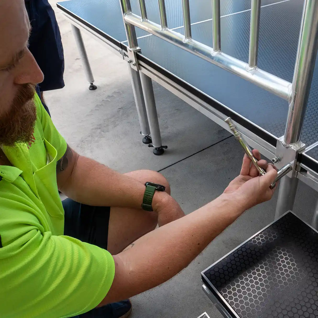 Rick securing Stage Deck Guard Rail to staging